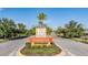 Welcoming entrance to the Mariposa community with lush landscaping and decorative signage at 5416 Camberwell Ln, Riverview, FL 33578