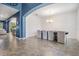 Dining room with tile floors, gray chairs, modern chandelier, and archway entrance at 5416 Camberwell Ln, Riverview, FL 33578