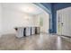 Bright dining area with tile floors, modern chandelier, gray chairs, and a large window at 5416 Camberwell Ln, Riverview, FL 33578