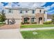 Two-story home showcases blue shutters, light gray siding, a stone accented entrance and manicured lawn at 5416 Camberwell Ln, Riverview, FL 33578