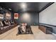 Enjoy movie nights in this home theater with recliners, a large screen, and a projector for the ultimate viewing experience at 5416 Camberwell Ln, Riverview, FL 33578