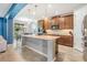 Open kitchen boasts a center island, stainless steel appliances, and easy access to the dining area at 5416 Camberwell Ln, Riverview, FL 33578