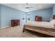 Bright and airy main bedroom with carpet floors, abundant natural light, and neutral walls, creating a peaceful retreat at 5416 Camberwell Ln, Riverview, FL 33578