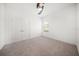 Cozy bedroom with carpet, ceiling fan, and closet with double doors at 5547 Silver Sun Dr, Apollo Beach, FL 33572