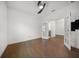 Bedroom with wood floors and french doors leading to the Primary bathroom at 5547 Silver Sun Dr, Apollo Beach, FL 33572