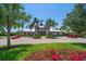 Community clubhouse with manicured landscaping, showcasing a welcoming and well-maintained amenity at 5547 Silver Sun Dr, Apollo Beach, FL 33572