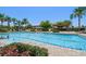 Large community pool with lap lanes, pergolas, and plenty of lounge chairs for relaxation at 5547 Silver Sun Dr, Apollo Beach, FL 33572