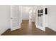 Bright entryway featuring hardwood floors and decorative, divided-light French doors at 5547 Silver Sun Dr, Apollo Beach, FL 33572