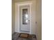 Elegant front door with decorative glass, framed by white trim and a brick-paved porch at 5547 Silver Sun Dr, Apollo Beach, FL 33572