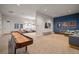 A lively game room with shuffleboard, seating, and a TV, perfect for entertaining and relaxation at 5547 Silver Sun Dr, Apollo Beach, FL 33572