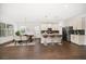 Bright, open kitchen featuring a center island with seating and stainless steel appliances at 5547 Silver Sun Dr, Apollo Beach, FL 33572