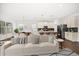 Inviting living room flowing into a dining area and modern kitchen, perfect for entertaining at 5547 Silver Sun Dr, Apollo Beach, FL 33572