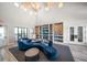 The lounge area features stylish decor, a vaulted ceiling, and comfortable seating for relaxing and socializing at 5547 Silver Sun Dr, Apollo Beach, FL 33572
