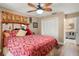 Bedroom featuring hardwood floors, ceiling fan, and closet at 5761 Colonial Dr, New Port Richey, FL 34653
