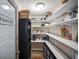Organized pantry with ample shelving for storage and a convenient layout at 5761 Colonial Dr, New Port Richey, FL 34653