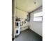 This utility room features a water heater, electrical panel and window for natural light at 5843 114Th N Ter, Pinellas Park, FL 33782