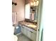 Bathroom featuring a modern vanity with a sink, marble countertops, and stylish fixtures at 6880 Versailles N, Pinellas Park, FL 33781