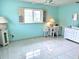 Inviting bedroom with tile floors, a neutral color scheme, and a bright window at 6880 Versailles N, Pinellas Park, FL 33781