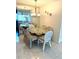 Cozy dining room features a glass table with seating for six at 6880 Versailles N, Pinellas Park, FL 33781