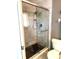Luxurious walk-in shower with marble tiles, glass enclosure, and dual shower heads at 6880 Versailles N, Pinellas Park, FL 33781