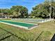 A shuffleboard court with a green surface ready for a friendly competition at 6880 Versailles N, Pinellas Park, FL 33781