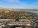 Scenic aerial view overlooking a lakeside community with lush greenery and distant city skyline at 800 S Dakota Ave # 241, Tampa, FL 33606