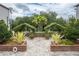 Beautifully landscaped courtyard with brick accents and lush greenery at 800 S Dakota Ave # 241, Tampa, FL 33606