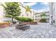 Charming courtyard with picnic tables, BBQ, and brick-lined garden beds at 800 S Dakota Ave # 241, Tampa, FL 33606