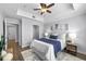 Bright primary bedroom with tray ceiling, ceiling fan, and a large closet at 800 S Dakota Ave # 241, Tampa, FL 33606