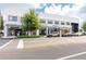 Street-level view of a modern retail building with multiple storefronts and pedestrian access at 800 S Dakota Ave # 241, Tampa, FL 33606