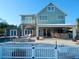 Beautiful two-story home with backyard pool, hot tub, covered outdoor bar, and fenced yard at 8025 Island Dr, Port Richey, FL 34668