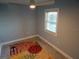 Comfortable bedroom with bright light and floral rug, ceiling fan, and light walls at 8025 Island Dr, Port Richey, FL 34668