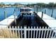 Modern boat lift provides convenient access to the water from this waterfront property at 8025 Island Dr, Port Richey, FL 34668