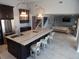 Open kitchen with island seating that flows into the living room, creating a seamless entertaining space at 8025 Island Dr, Port Richey, FL 34668