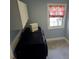 Practical laundry room with modern appliances, a charming window, and ample counter space at 8025 Island Dr, Port Richey, FL 34668