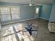 Inviting living room with ceiling fan, lots of light, and a starfish-themed rug at 8025 Island Dr, Port Richey, FL 34668