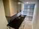 Spacious pantry featuring abundant shelving, a countertop, and cabinetry for kitchenware storage at 8025 Island Dr, Port Richey, FL 34668