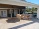 Large patio features an outdoor bar area with seating and access to a waterway at 8025 Island Dr, Port Richey, FL 34668