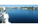 Picturesque waterfront scene with boats and lush greenery creating a tranquil and inviting atmosphere at 8025 Island Dr, Port Richey, FL 34668