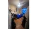 Bedroom with blue bedspread and ceiling fan at 8203 N Semmes St, Tampa, FL 33604