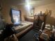 Bedroom with a ceiling fan and dark carpet at 8203 N Semmes St, Tampa, FL 33604