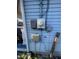 Close up of the exterior utilities to the property with exposed wiring on the wall at 8203 N Semmes St, Tampa, FL 33604