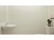 Powder room with pedestal sink, toilet, neutral wall color, and decorative plant at 8444 Sea Ray Run, Parrish, FL 34219