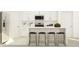Modern kitchen featuring white cabinets, stainless steel appliances, and a center island with stool seating at 8444 Sea Ray Run, Parrish, FL 34219