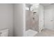 Bathroom featuring tiled shower with a shower niche and tiled flooring at 9066 Rally Spring Loop, Wesley Chapel, FL 33545