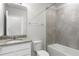 Bathroom featuring a vanity with granite countertop and shower-tub combo at 9066 Rally Spring Loop, Wesley Chapel, FL 33545