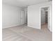 Carpeted bedroom with neutral walls and an open doorway at 9066 Rally Spring Loop, Wesley Chapel, FL 33545