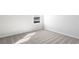 Empty bedroom with a window and carpeting at 9066 Rally Spring Loop, Wesley Chapel, FL 33545