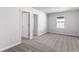 Bright bedroom with a window and carpeting at 9066 Rally Spring Loop, Wesley Chapel, FL 33545