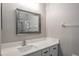 Bathroom vanity features white counter and modern mirror at 9500 Green Needle Dr, New Port Richey, FL 34655